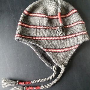Grey red and white striped beanie with tassels